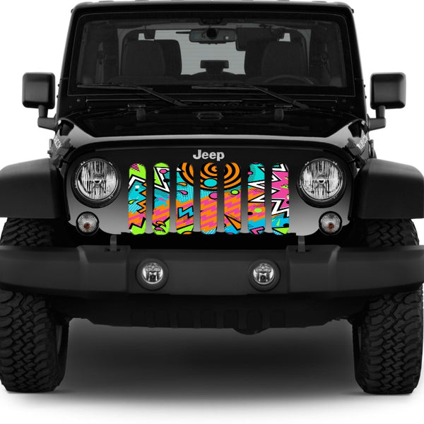 Jeep grille insert design with an array of geometric shapes and a variety of colors. Very 90's retro pattern Jeep grille insert displayed on a black Jeep Wrangler.