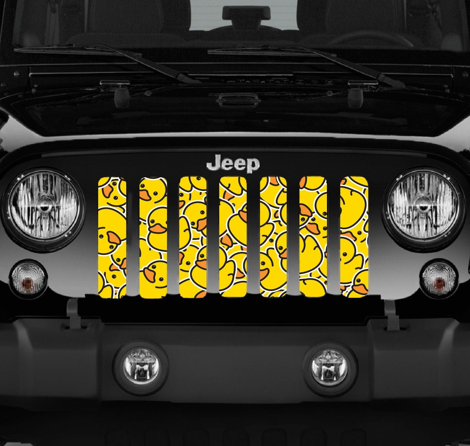 Close up view of a Black Jeep Wrangler showcasing Rubber Duck Pattern Design Jeep Grille Insert
