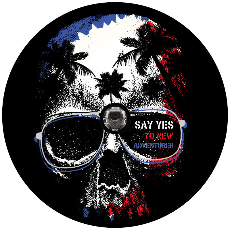 Patriotic colors red white and blue silhouette of a skull with palm trees in the head wearing sunglasses graphic design spare tire cover for black vinyl tire covers. and a JL back up camera design