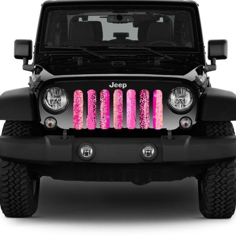 A blend of pink animal cheetah leopard print designed grille insert for Jeep.
