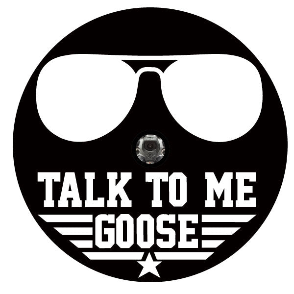 A spare tire cover design with the classic Top Gun aviator sunglasses silhouette and the saying, talk to me goose in classic retro Top Gun style font with the stars and stripes design. Design create for black vinyl spare tire cover and a slot for a back up camera