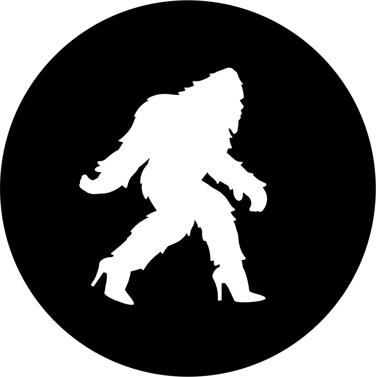 Black Vinyl Spare Tire Cover With A Silhouette Of A Bigfoot Shesquatch in high heels Walking Across The Center.
